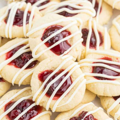 Cherry thumbprint cookies stacked together.