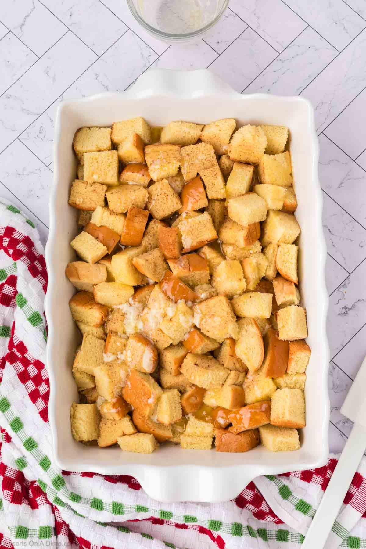 Melted butter drizzled over top of casserole dish. 