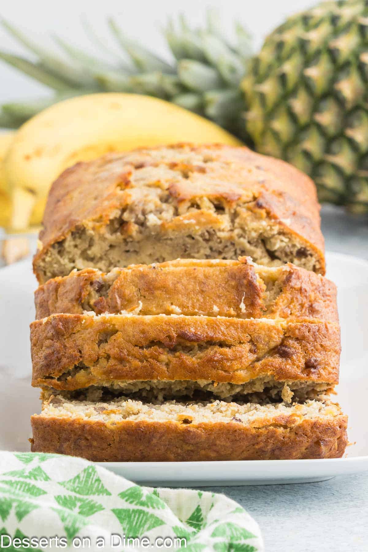 Banana Pineapple Bread sliced on a platter. 