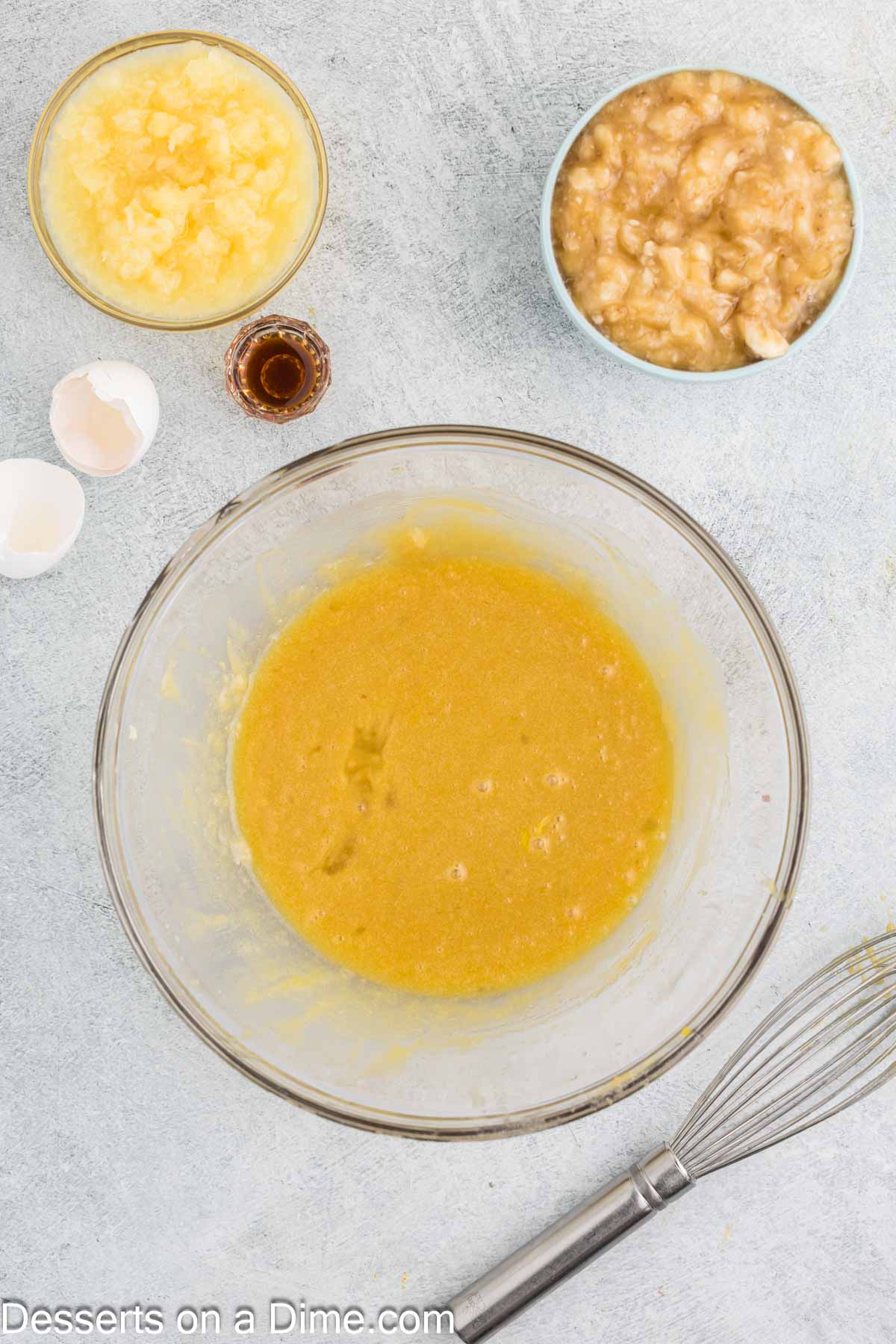 Eggs whisked together with butter mixture. 