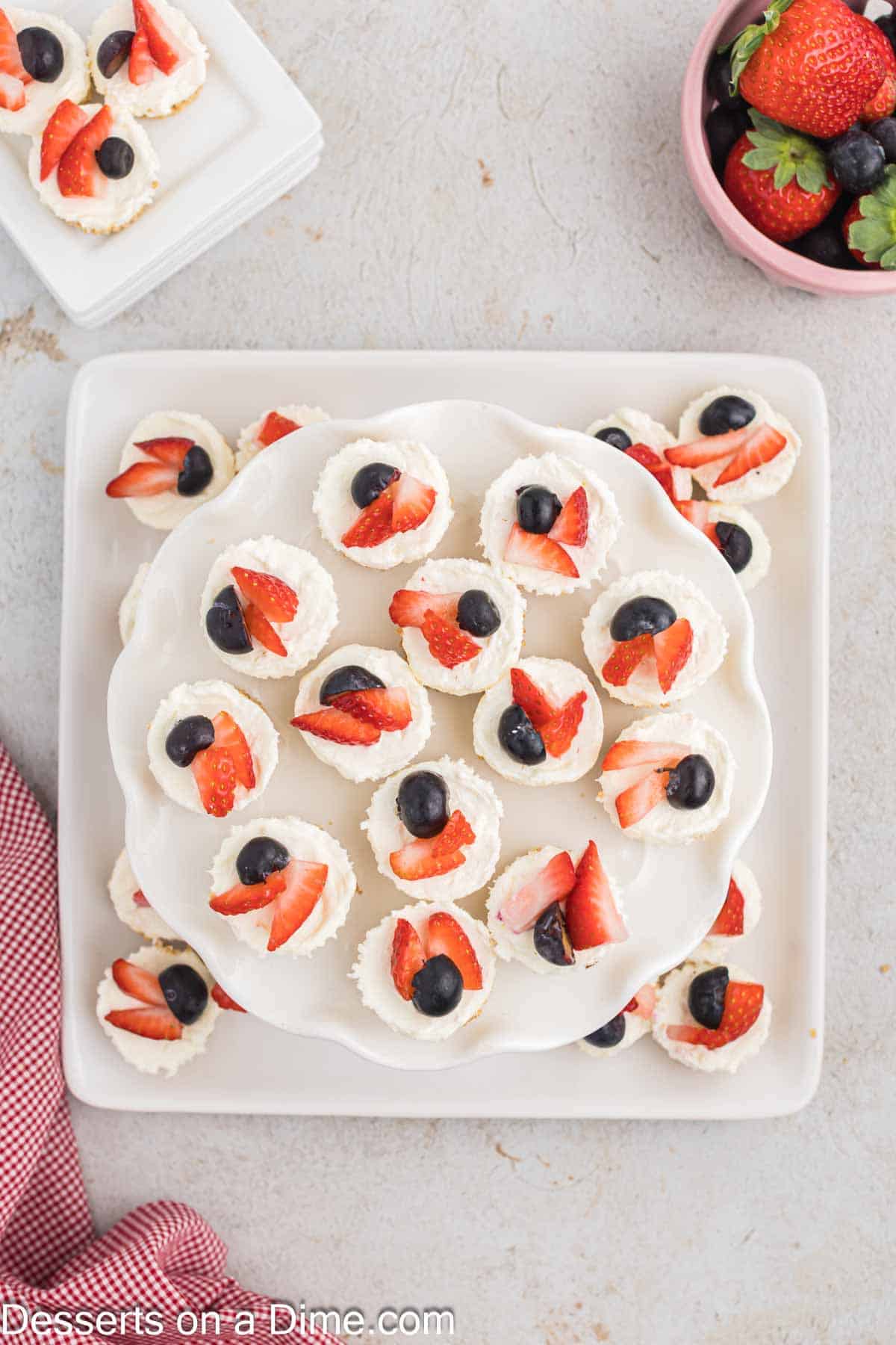 Mini cheesecakes on a platter. 