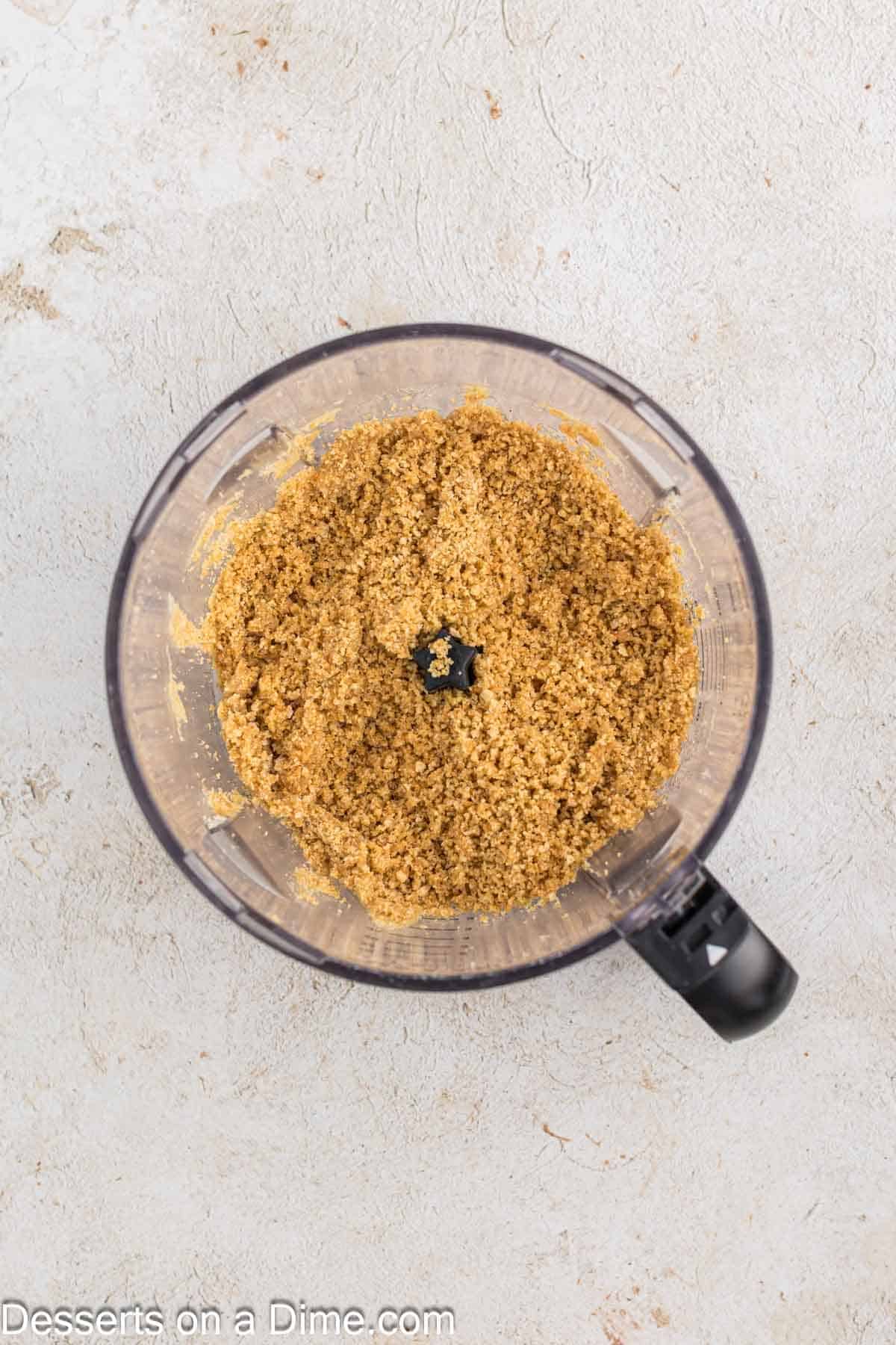 Graham cracker crumbs in food processor. 
