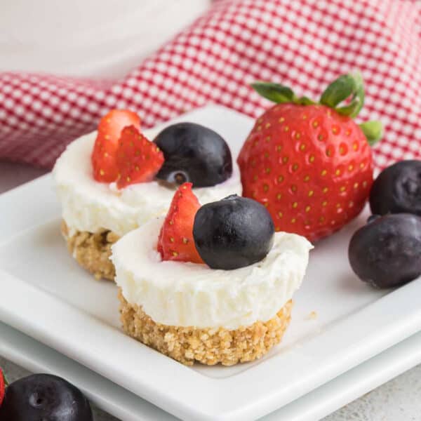 Mini cheesecake bites on a platter.