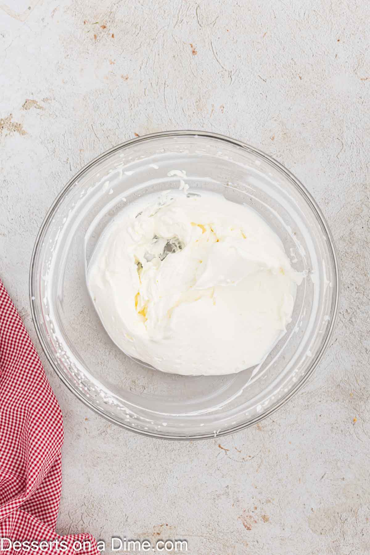 Whipping cream in a mixing bowl. 