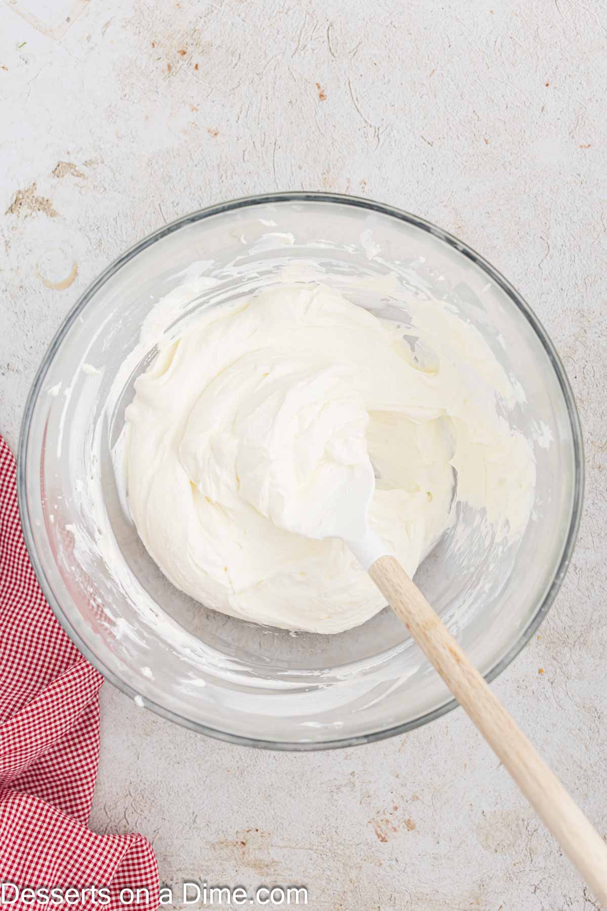 Whipped cream folded into cream cheese mixture. 