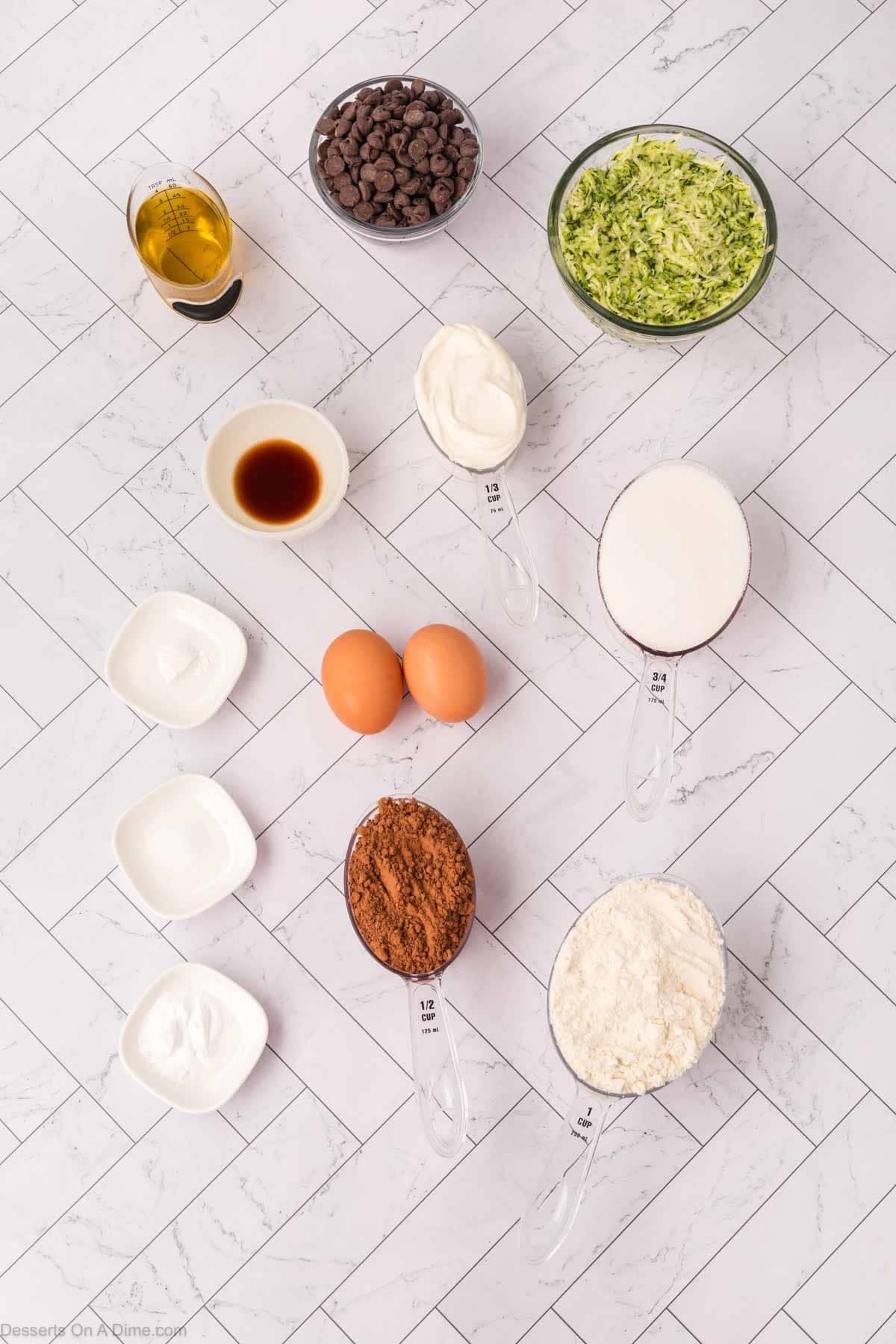 Chocolate Zucchini Bread - flour, cocoa powder, chocolate chips, eggs, oil, sour cream, sugar, vanilla, zucchini.