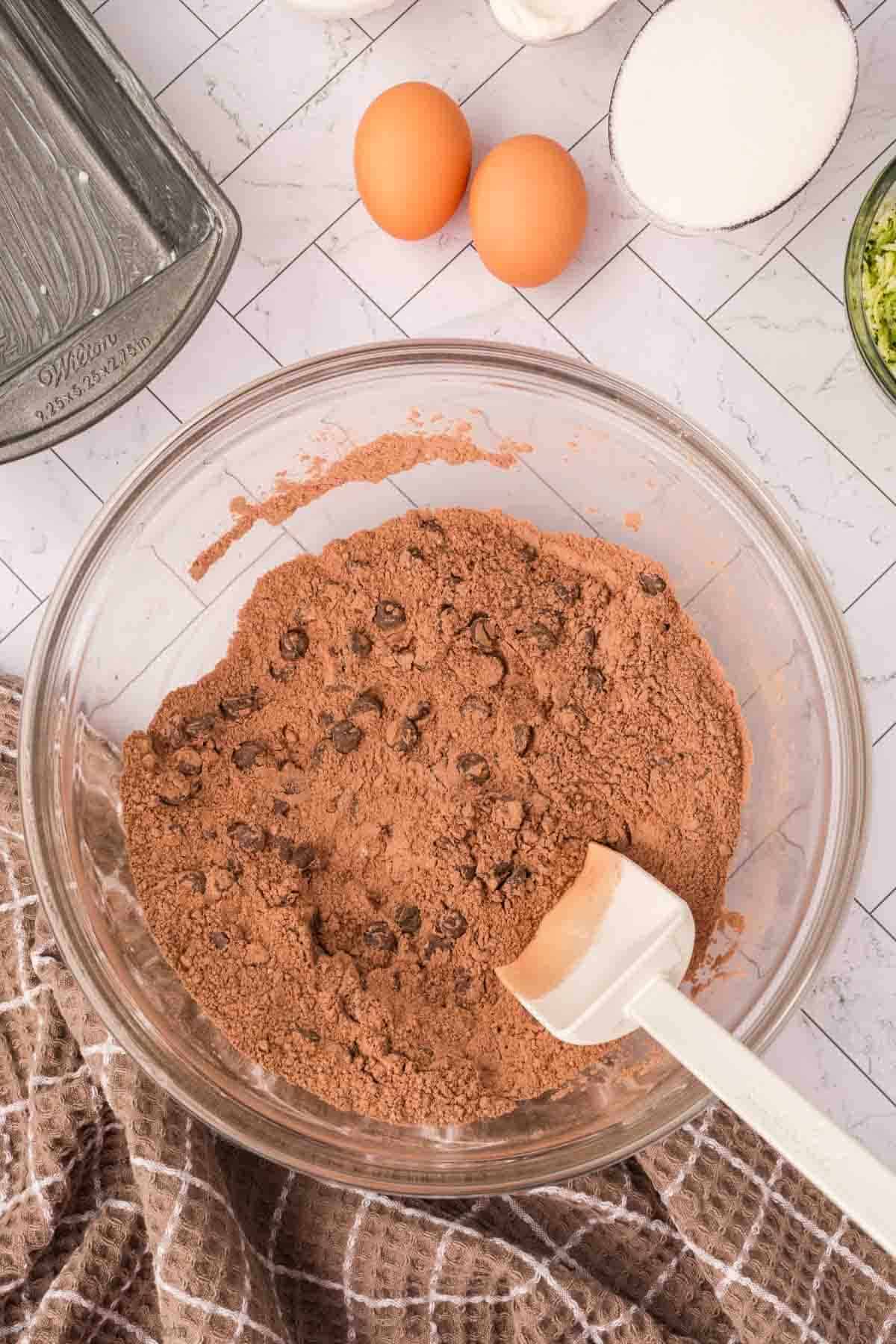 Chocolate chips mixed into bowl.
