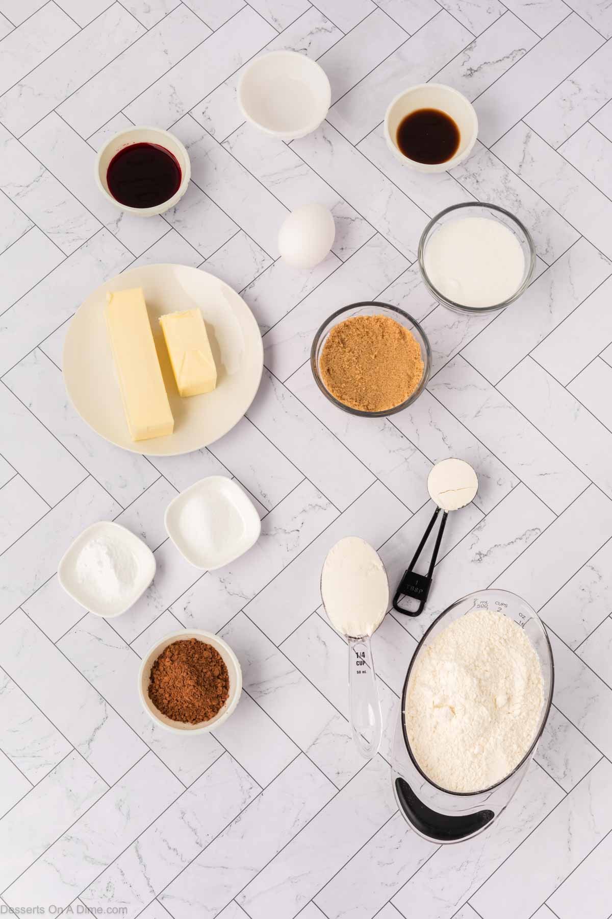 Ingredients for Red Velvet Cookies - flour, cocoa powder, baking soda, salt, butter, sugar, egg, vanilla, red food coloring.