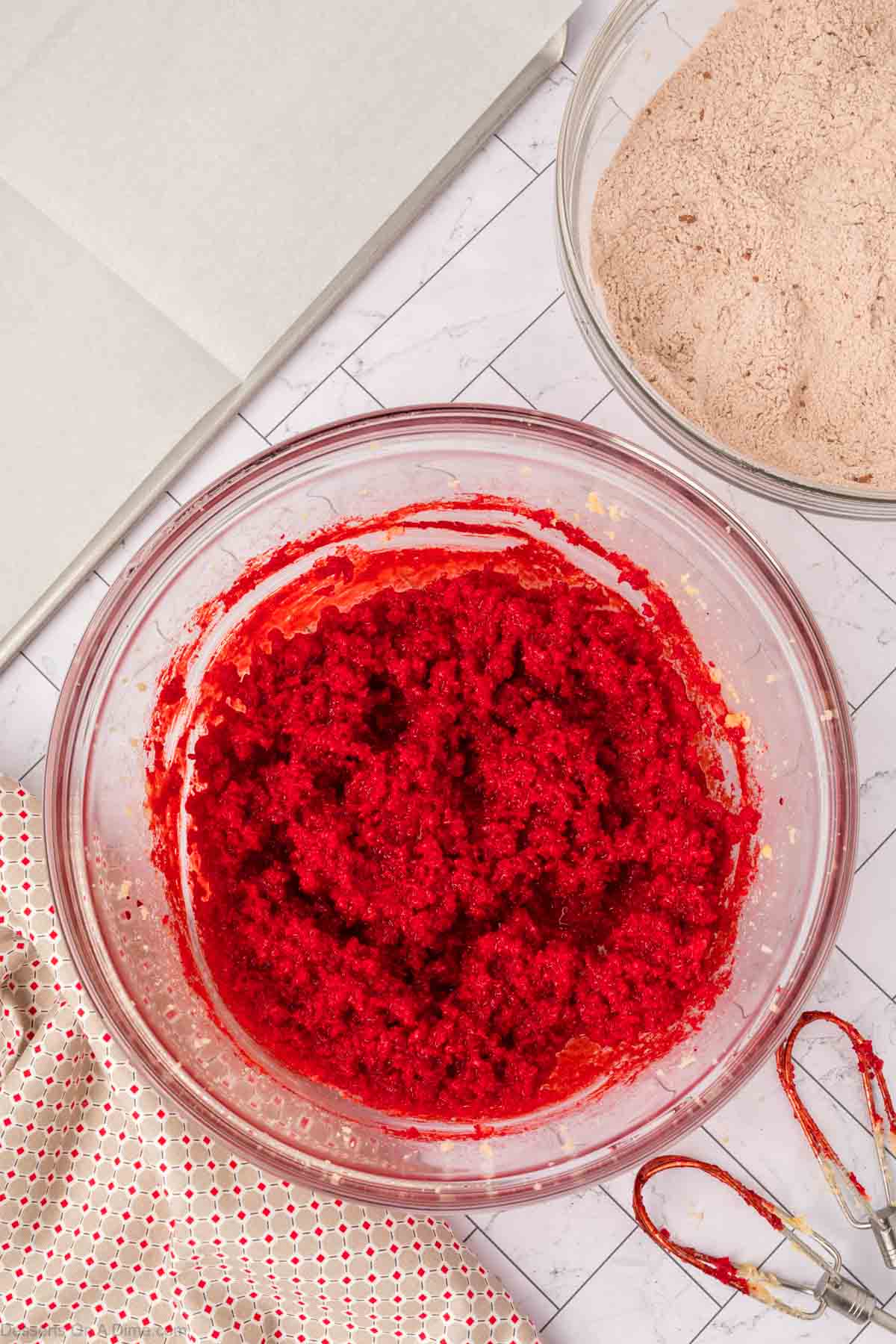 Egg and red food coloring mixed into batter.