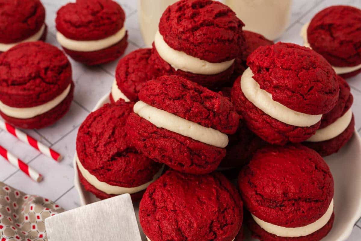 Red Velvet Sandwich Cookies stacked together on a platter.