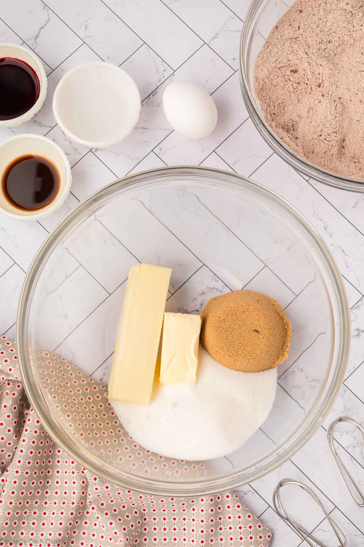 Butter and sugar in a mixing bowl ready to combine.
