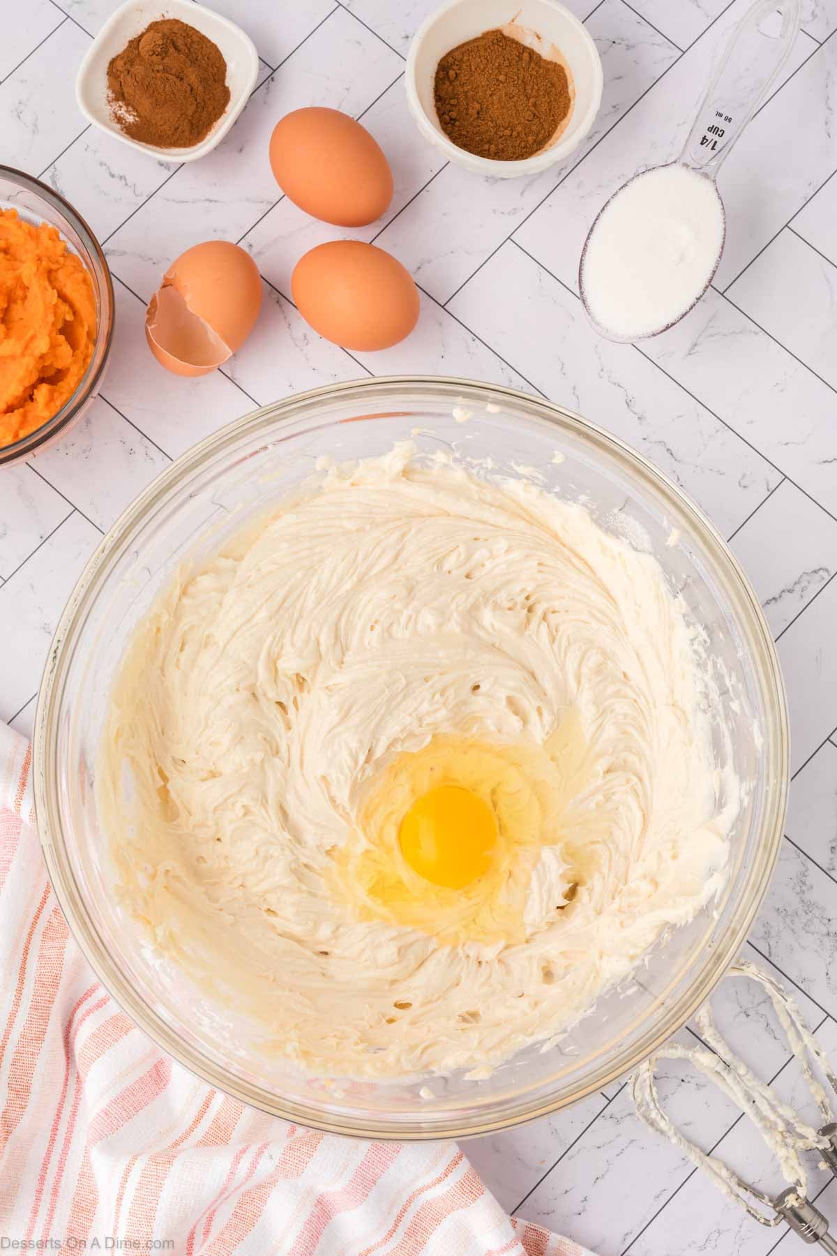 Eggs added one at a time into mixture. 