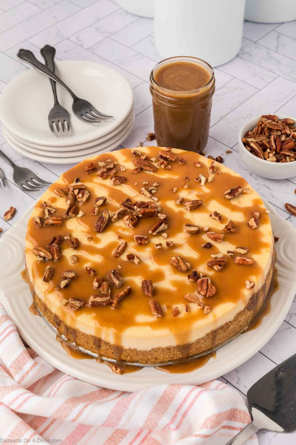Cheesecake topped with salted caramel and pecans. 