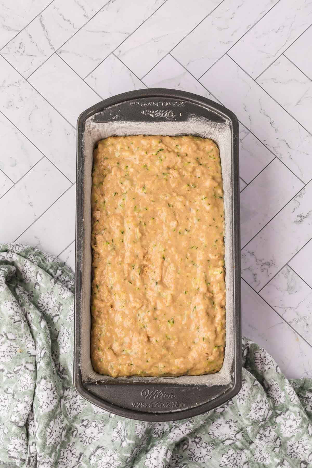 Batter poured into a loaf pan. 