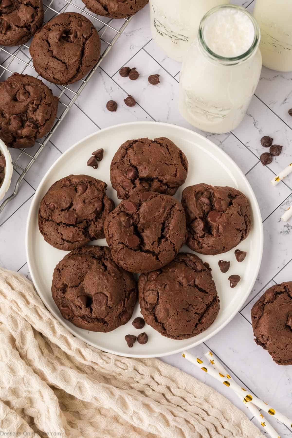Chocolate cake mix cookies on a white plate. 