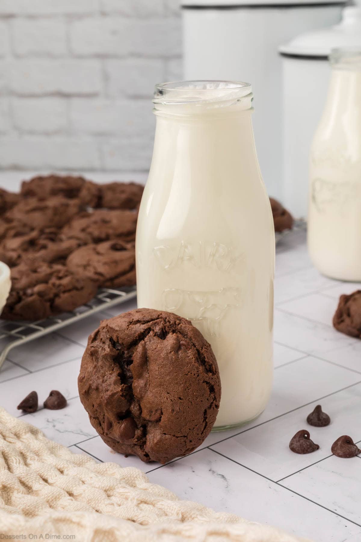 Chocolate Cake Mix Cookies beside a bottle of milk. 