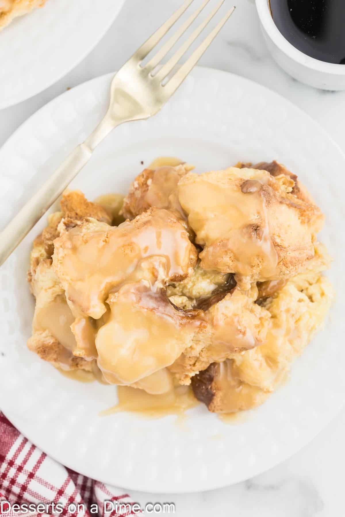 Caramel bread pudding on a plate. 
