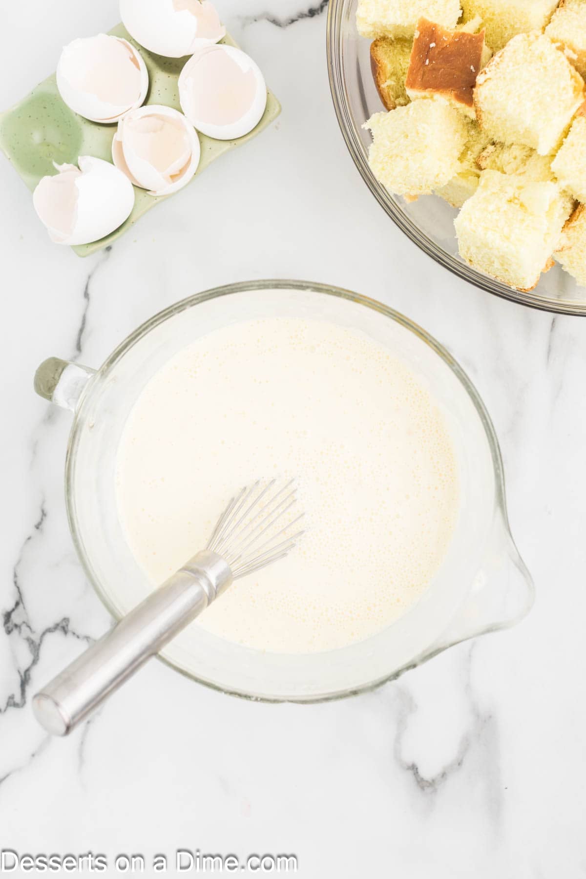 Mixing bowl with half and half and eggs. 
