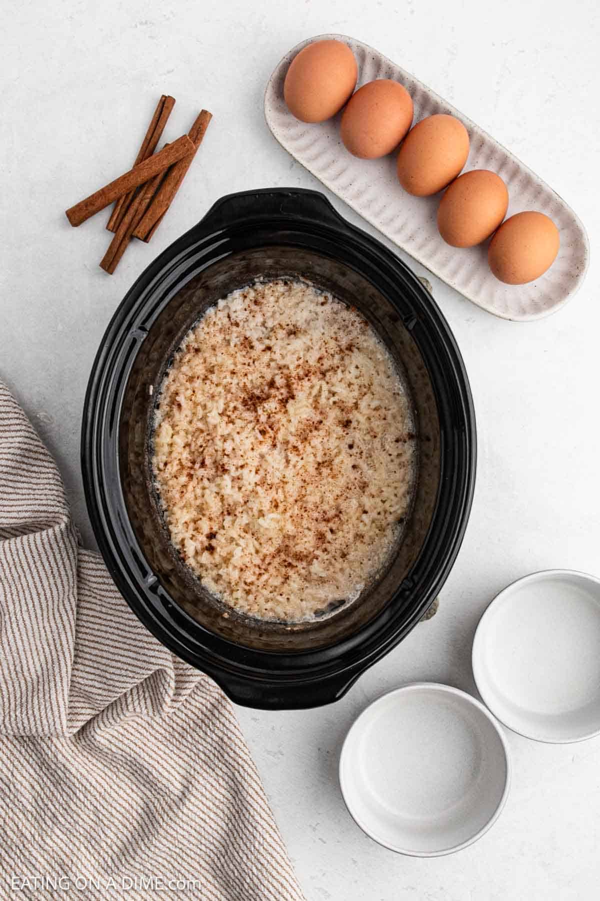 Rice poured into slow cooker. 