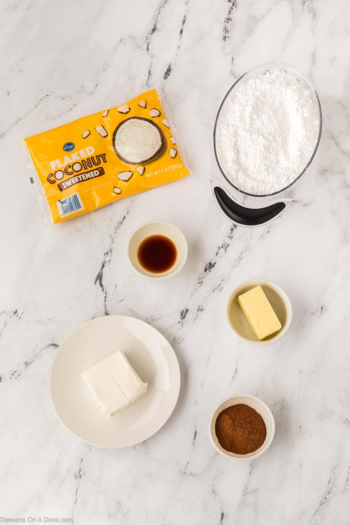 Ingredients for Irish potato candy - cinnamon, butter, cream cheese, vanilla, powdered sugar, coconut. 