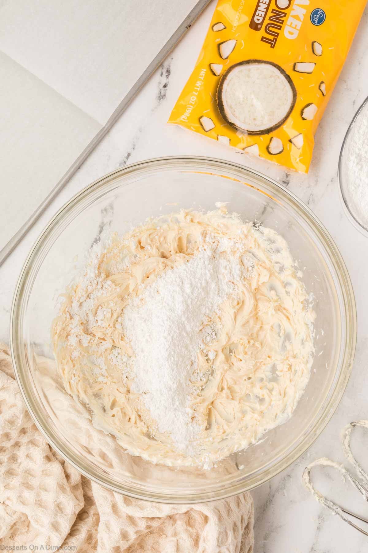 Coconut mixed into bowl. 