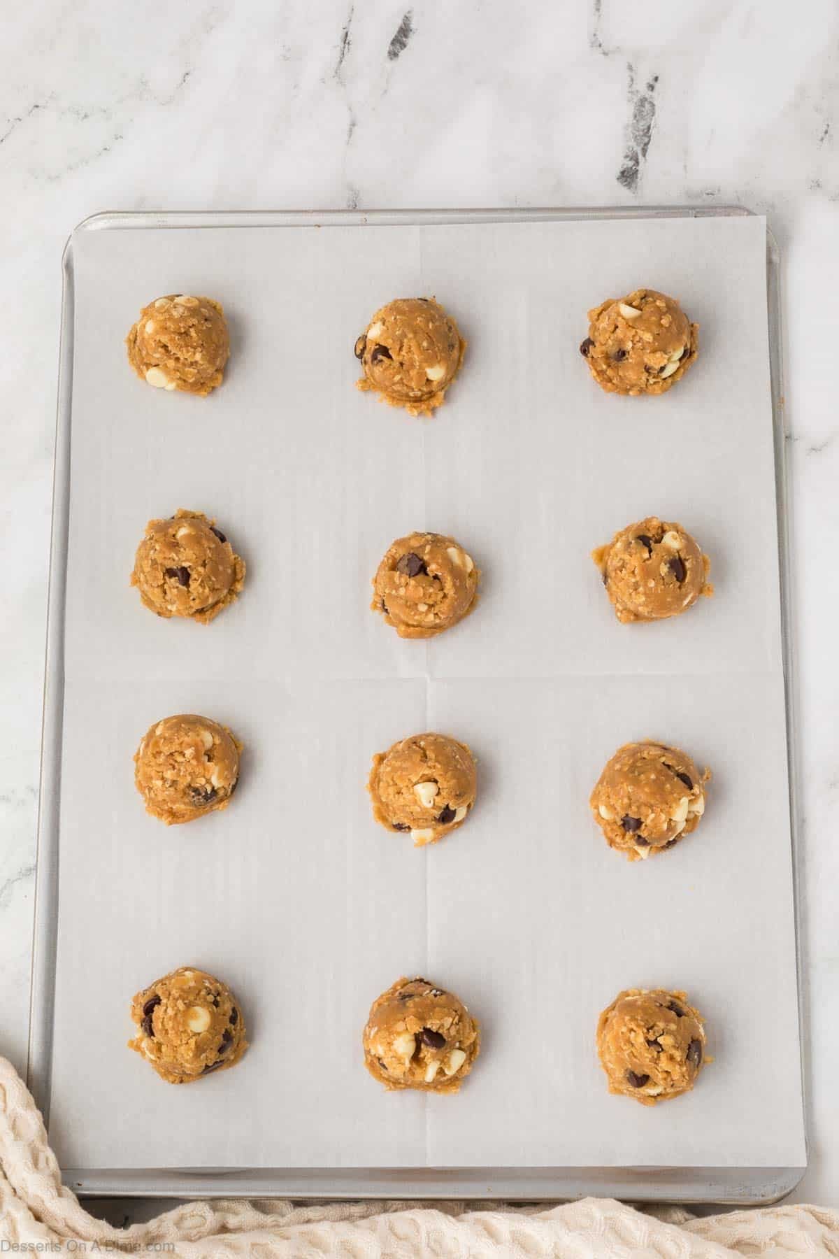 Dough balls on baking sheet ready to bake. 