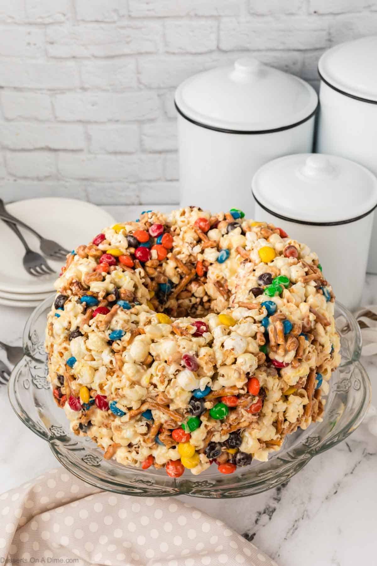 Popcorn cake on cake stand.