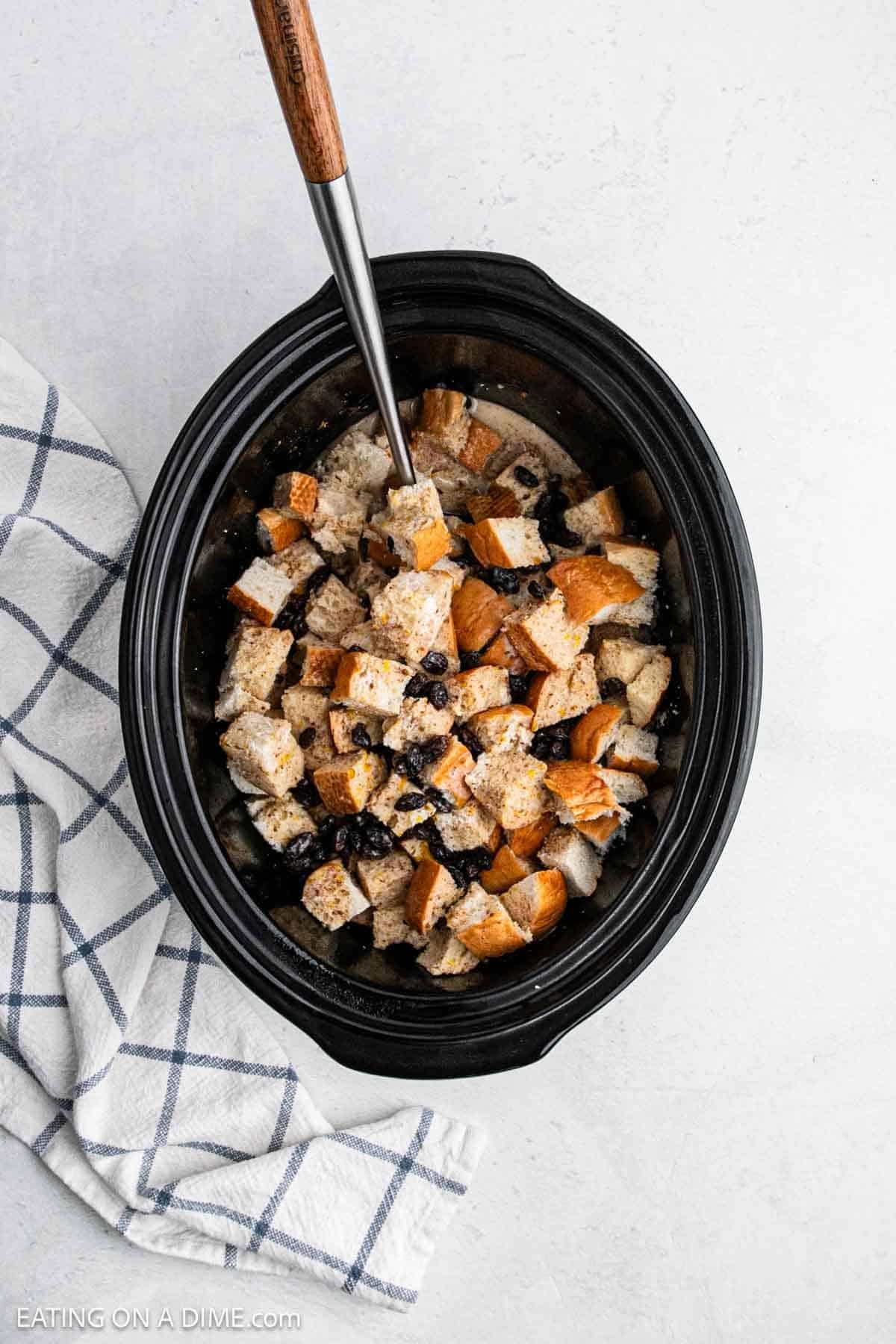 Bread soaked in milk in a crock pot. 