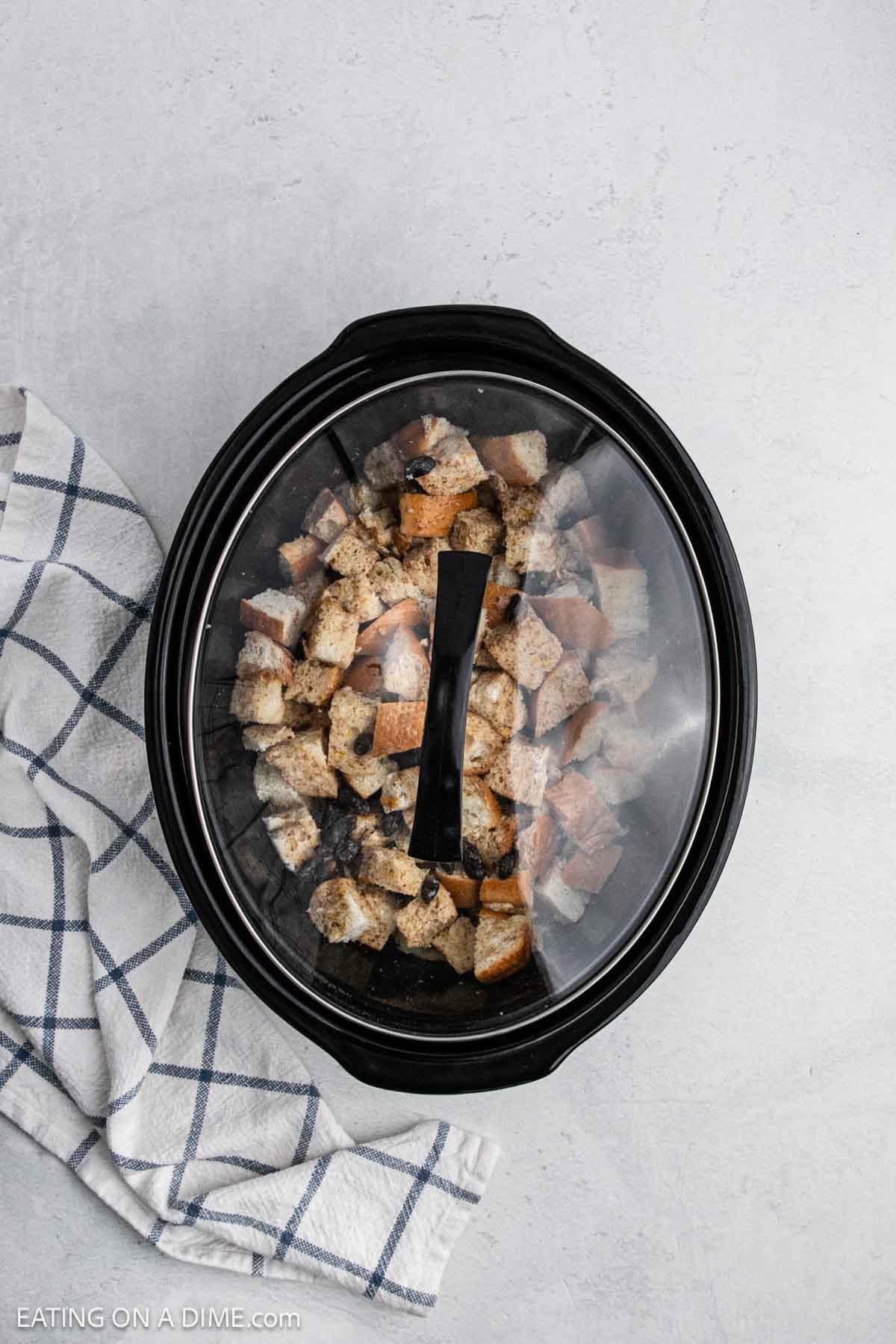 Lid placed on crock pot. 