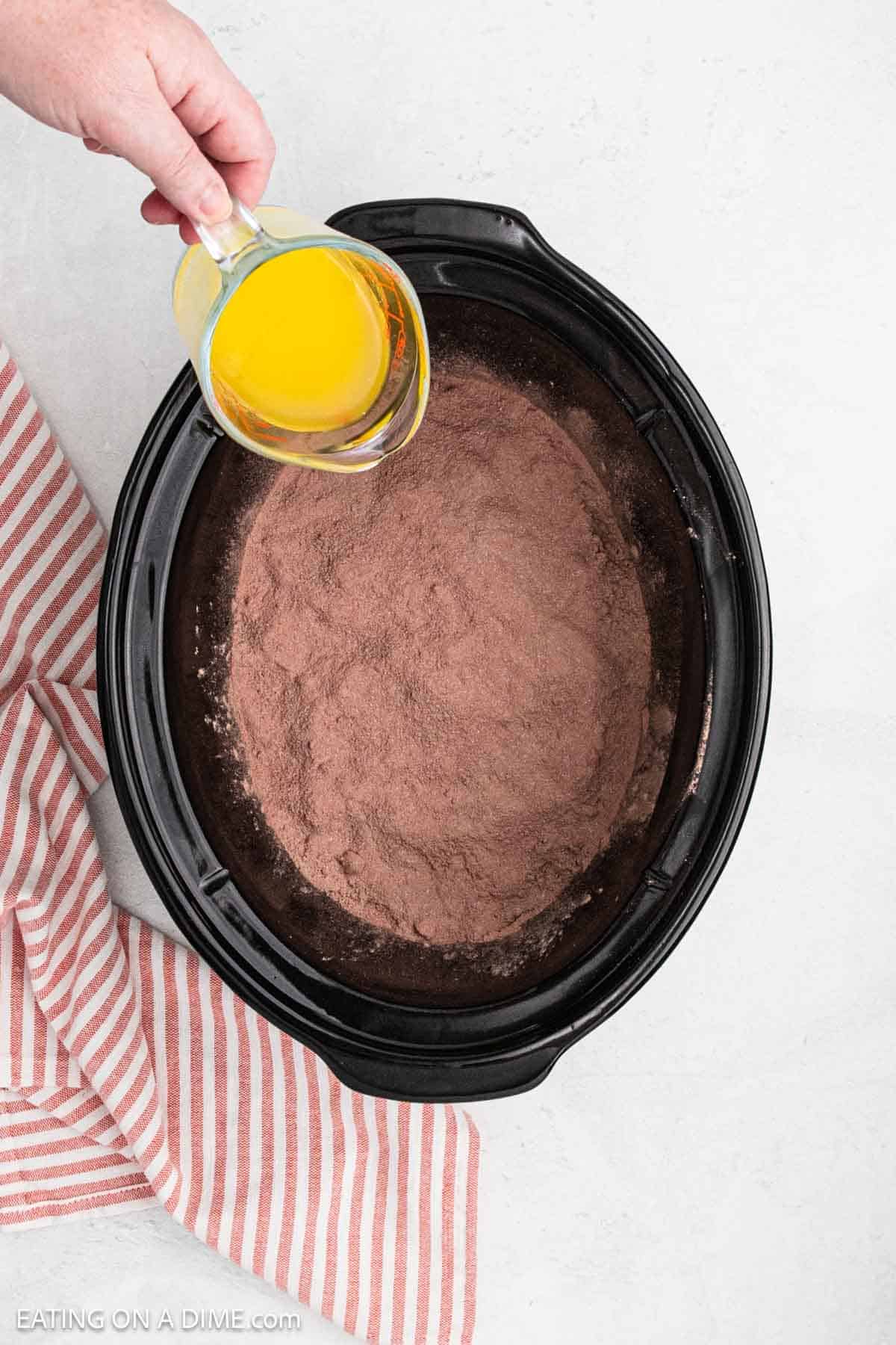 Melted butter poured over mix.