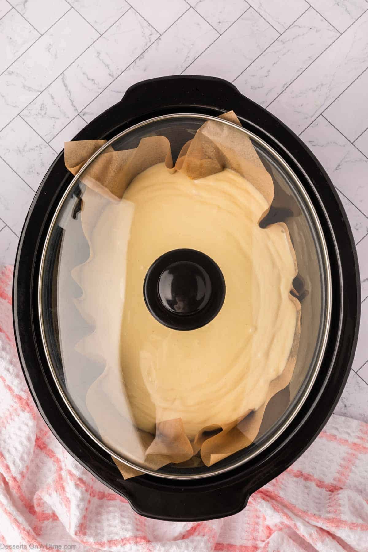Lid placed on crock pot. 