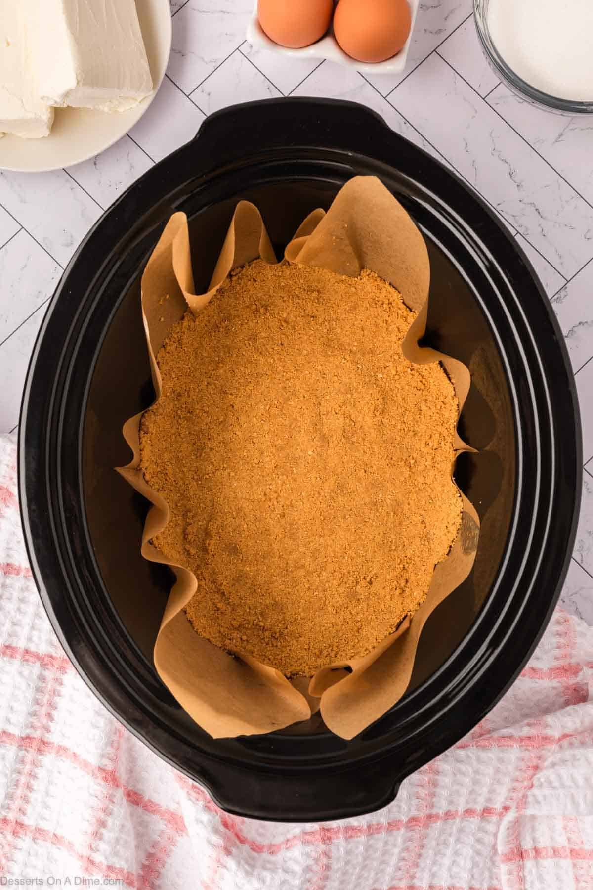 Graham cracker crust pressed into crock pot. 