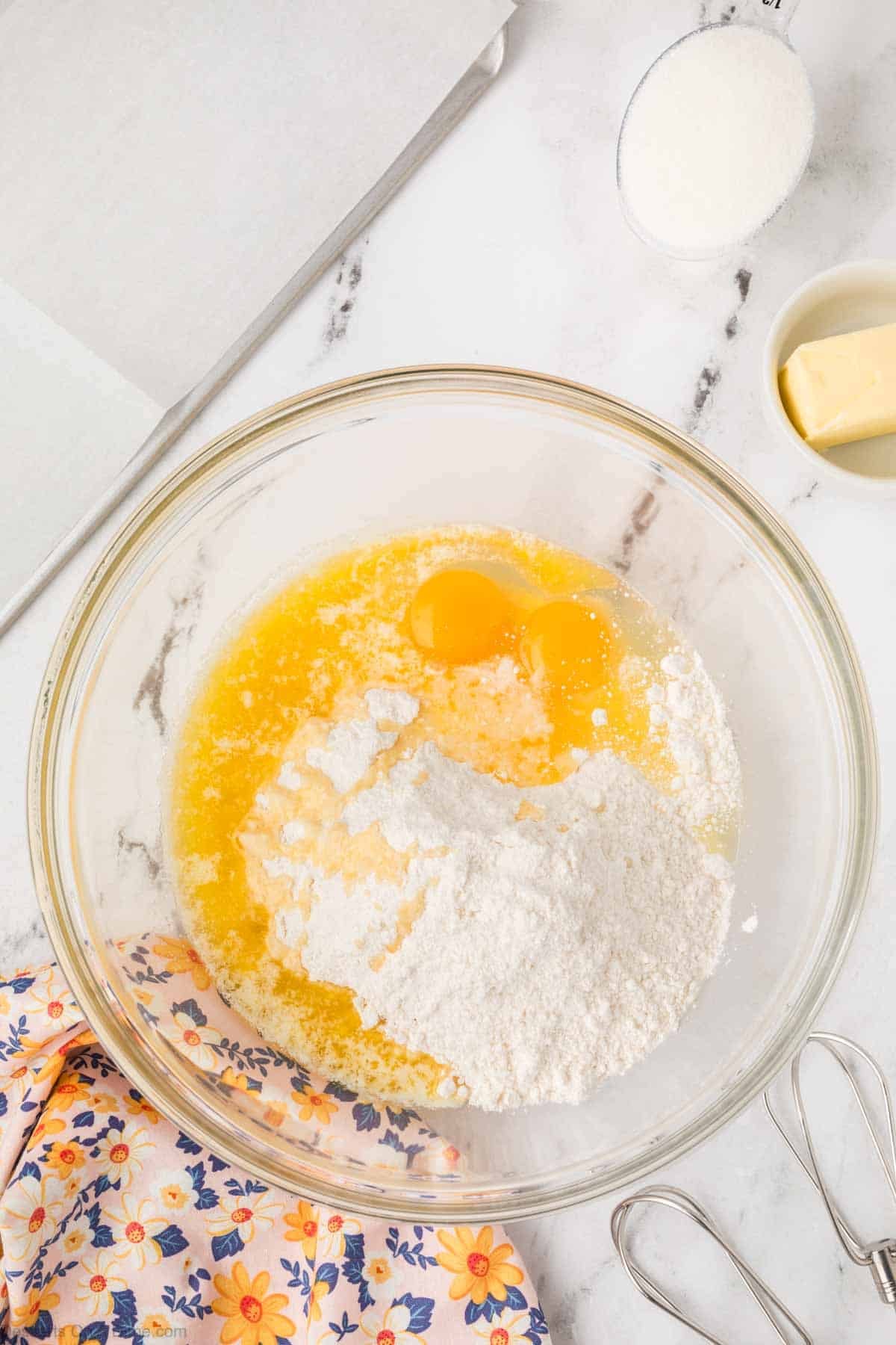 combining the egg, melted butter and cake mix together in a bowl