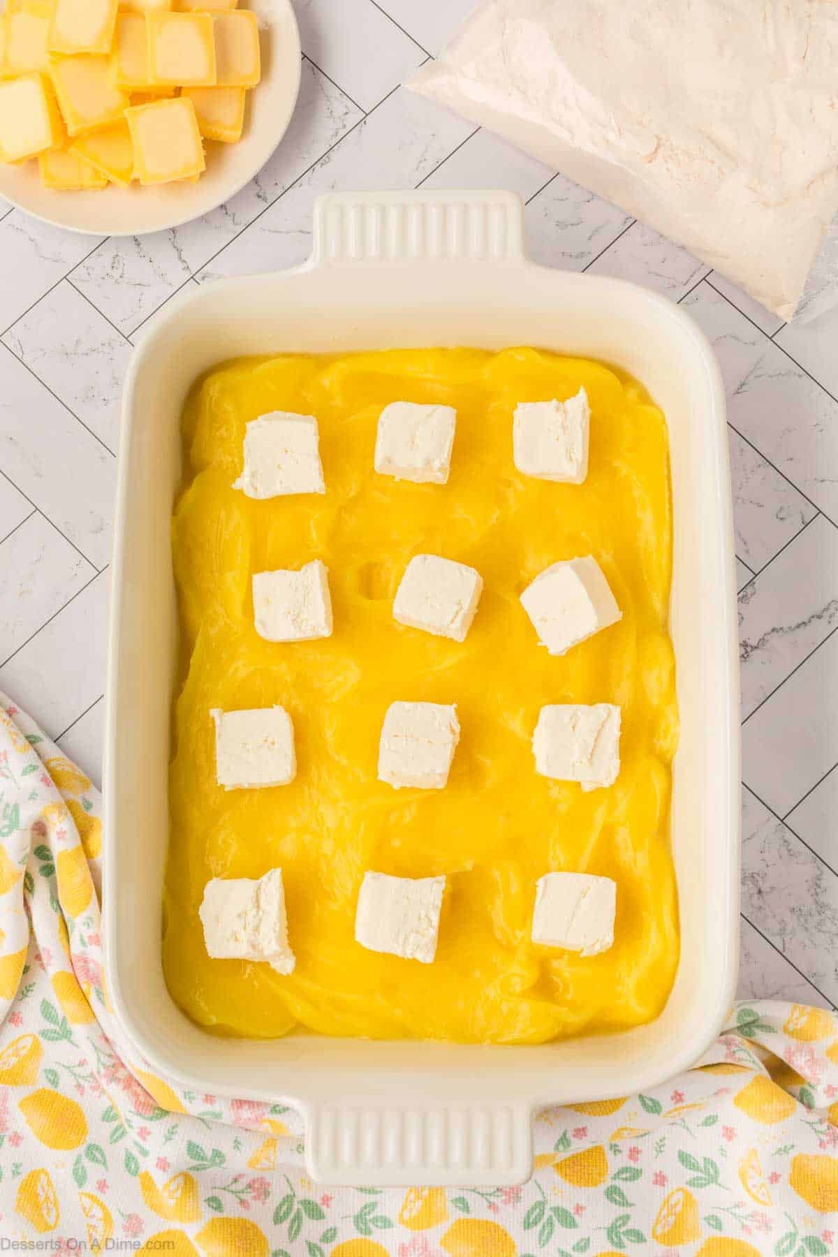 Cream cheese squares placed on top.