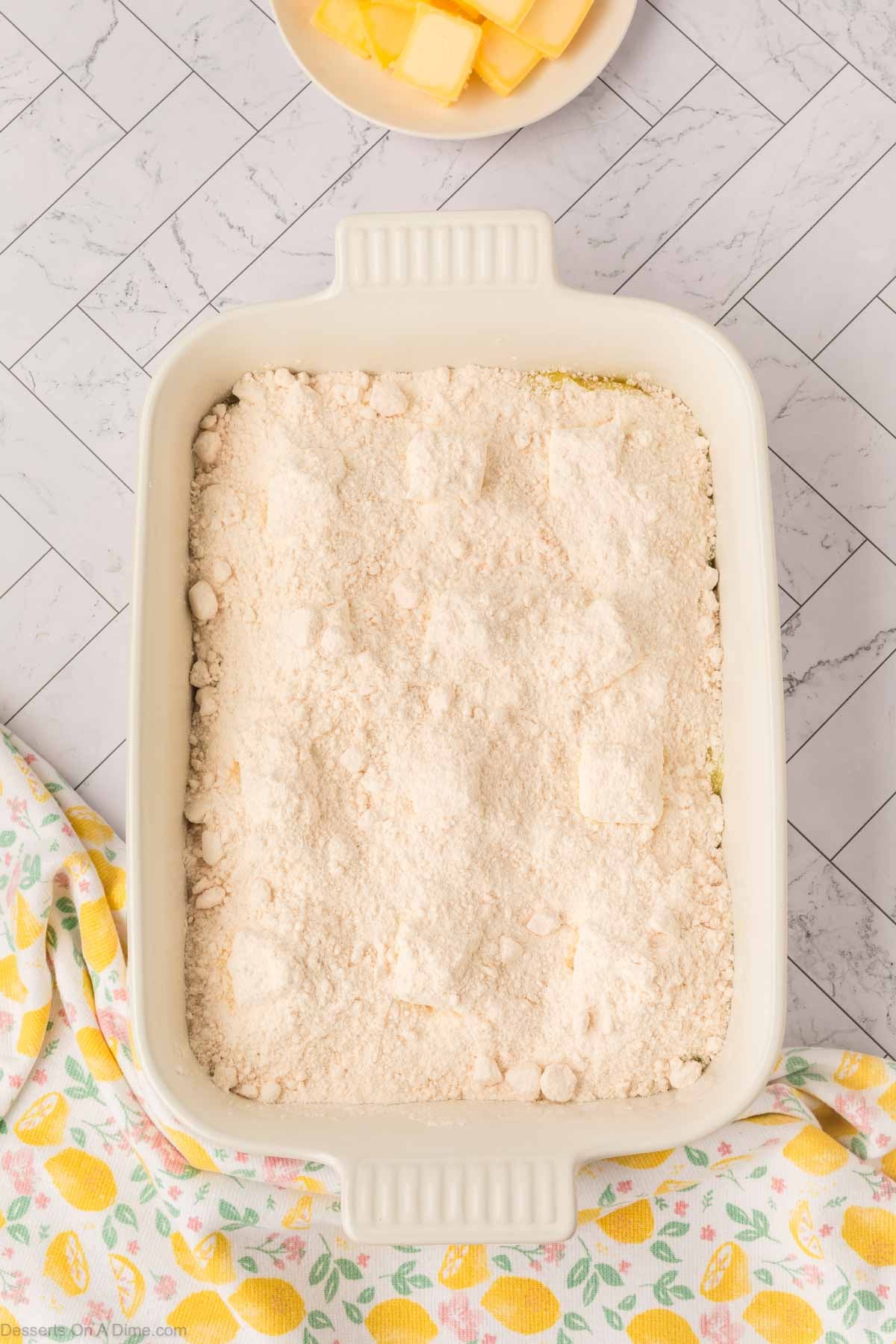 Cake mix spread on top. 