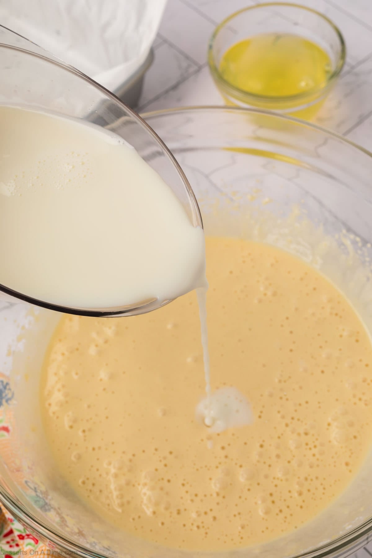 Milk poured into batter. 