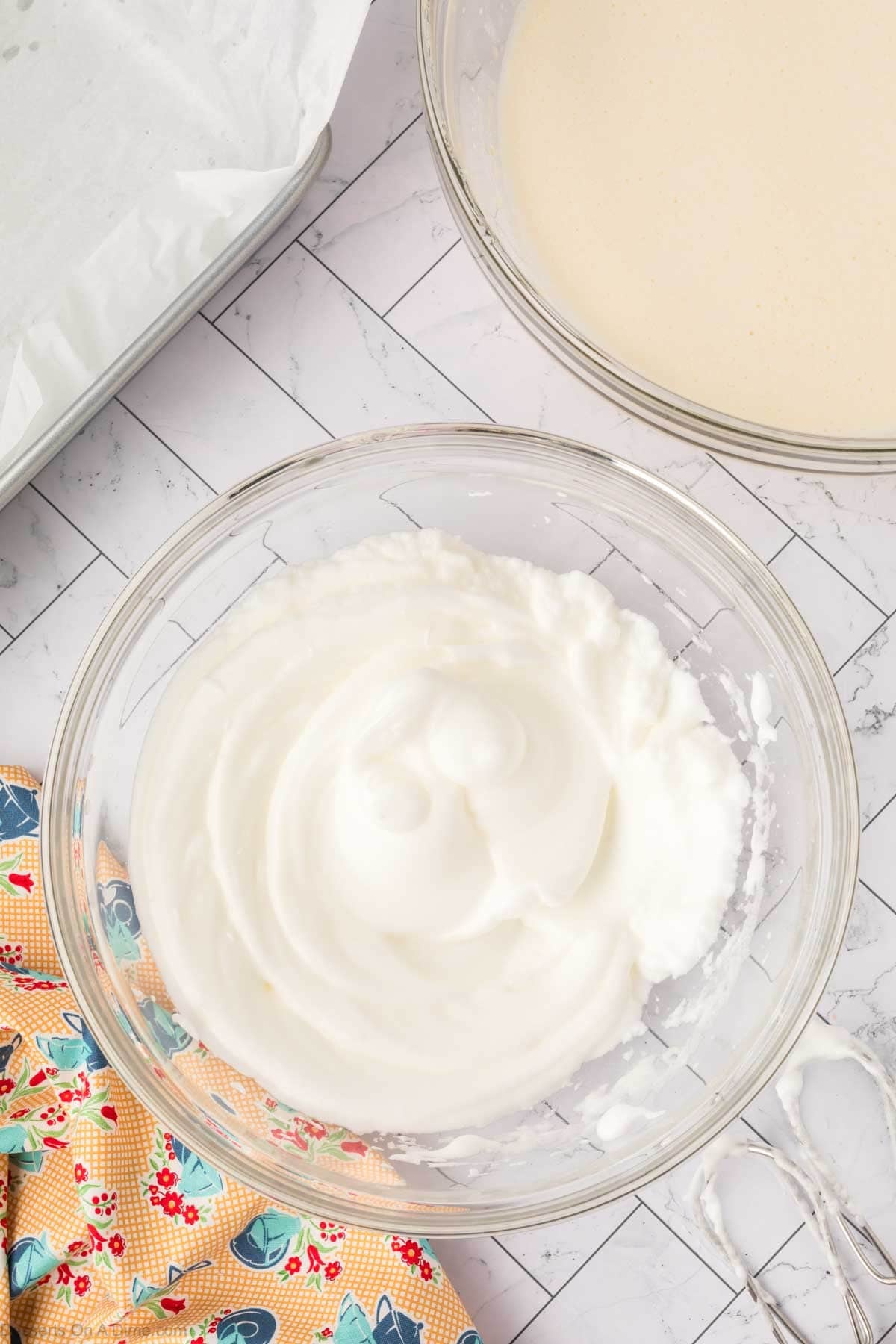 Egg whites beat until stiff peaks formed. 