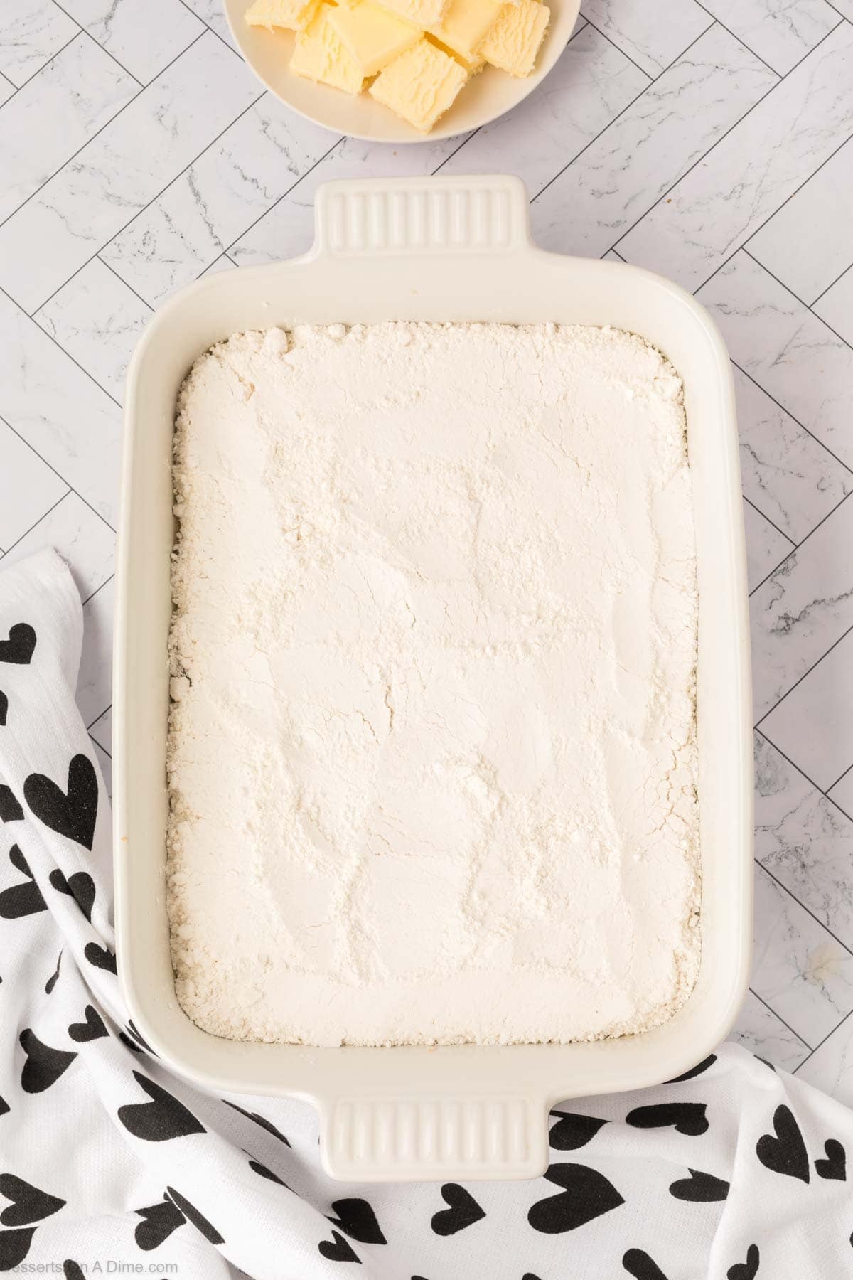 Cake mix spread over the top. 