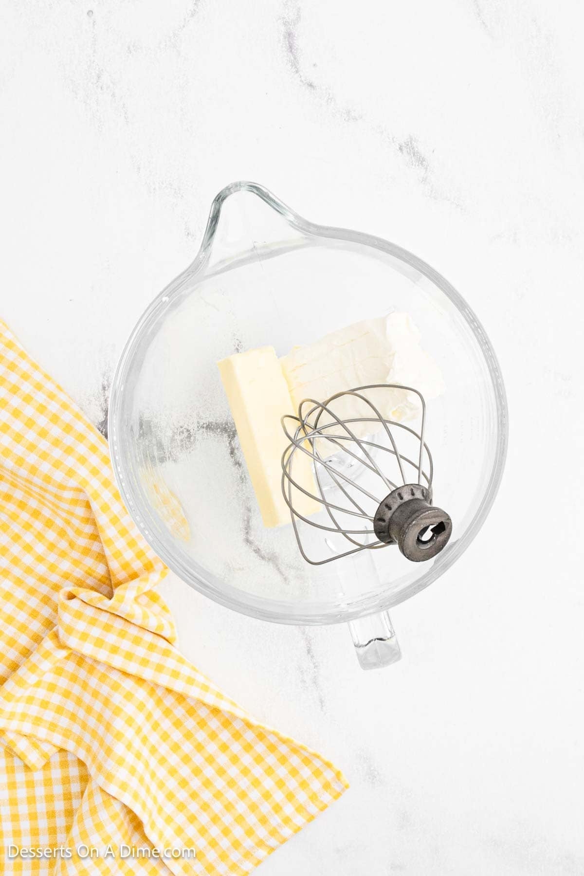 Butter and cream cheese in a mixer. 