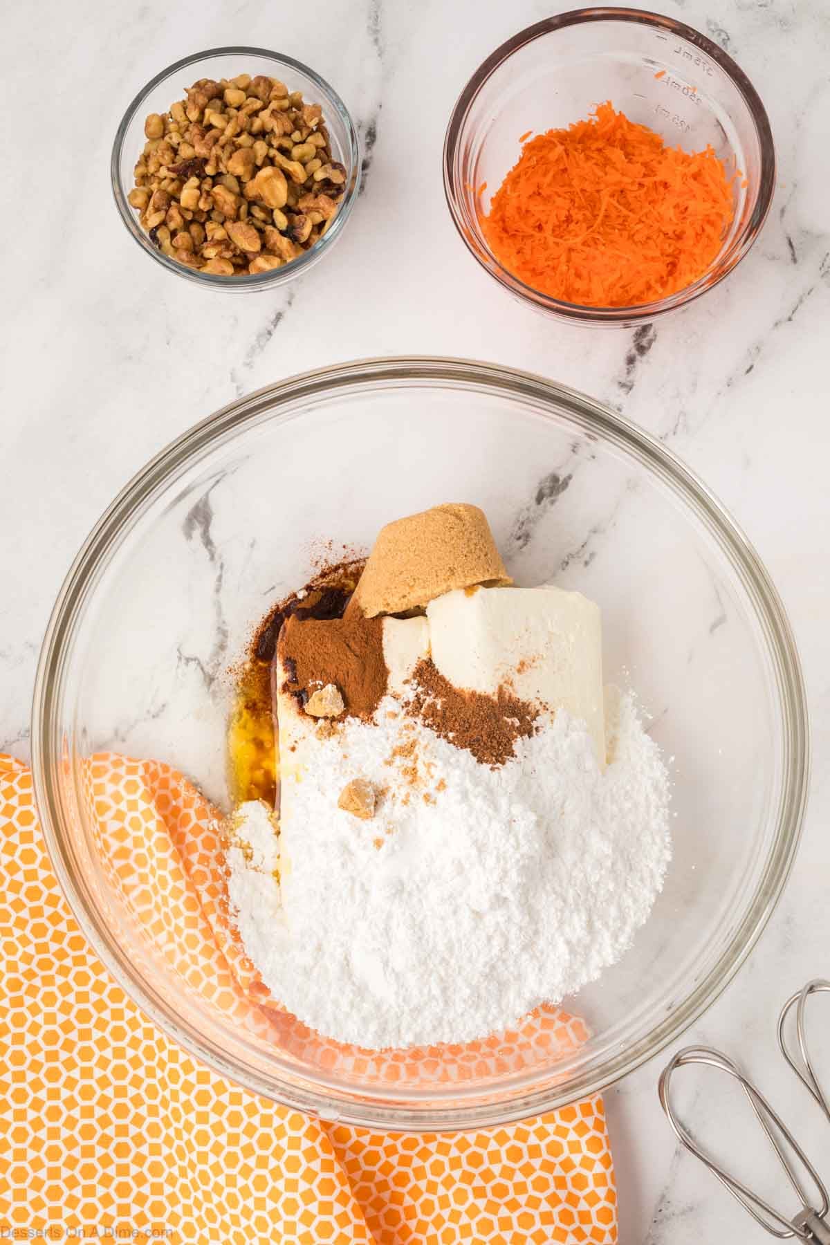Cream cheese, brown sugar, cinnamon and melted butter combined in a bowl. 