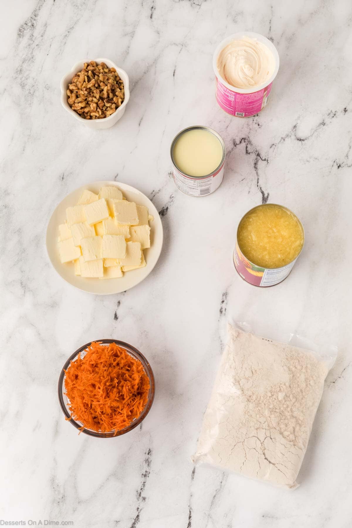 Ingredients for Carrot Cake Dump Cake - shredded carrots, crushed pineapple, sweetened condensed milk, spice cake mix, butter, pecans.