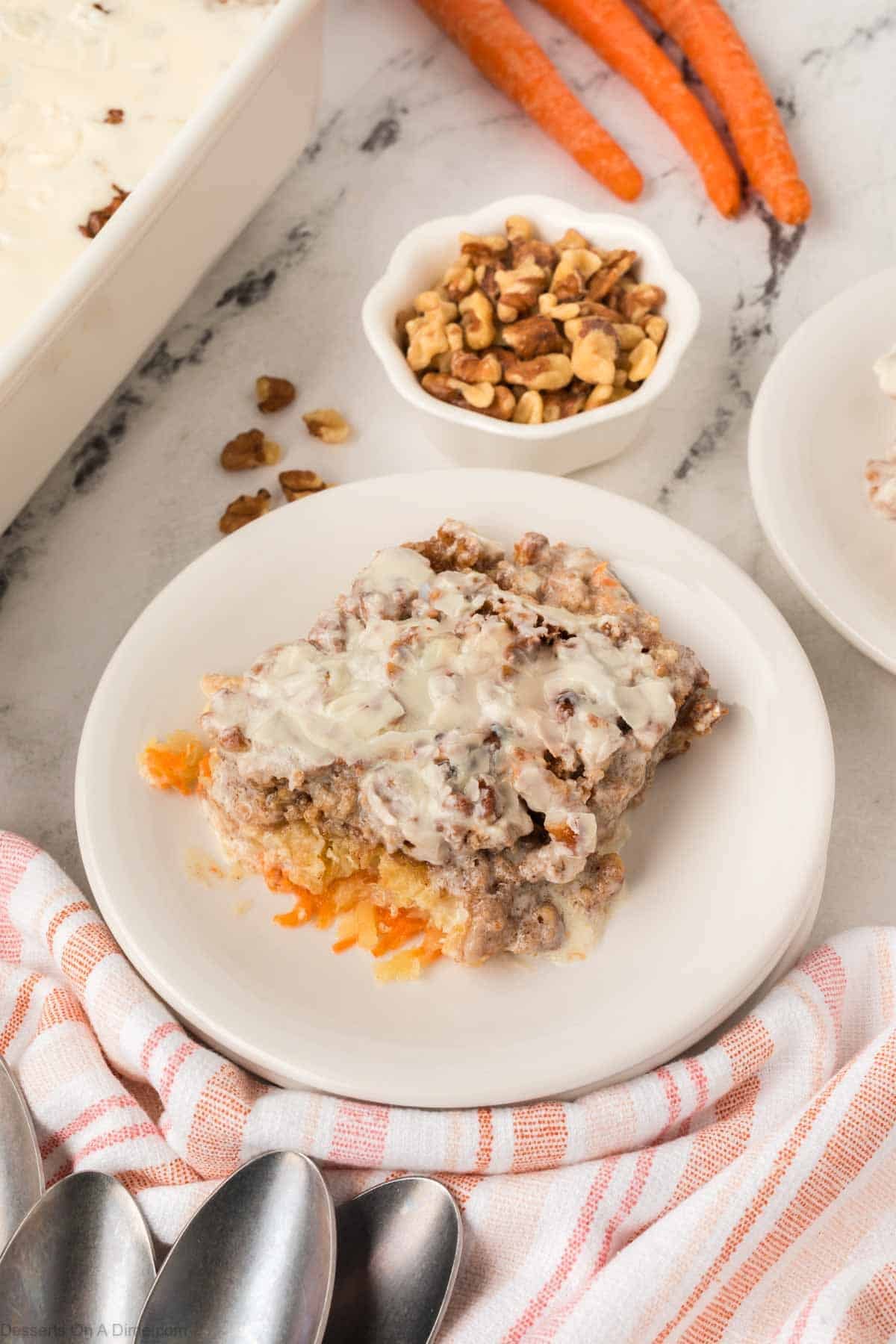 White plate with a slice of cake on top. 