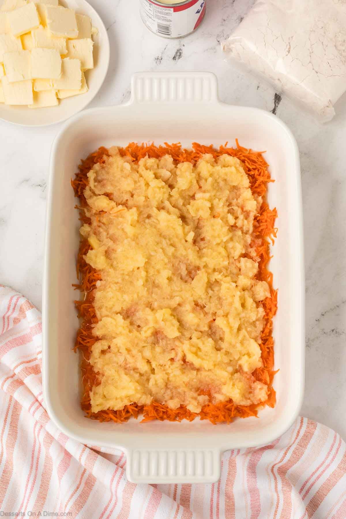 Shredded pineapple on top of carrots.