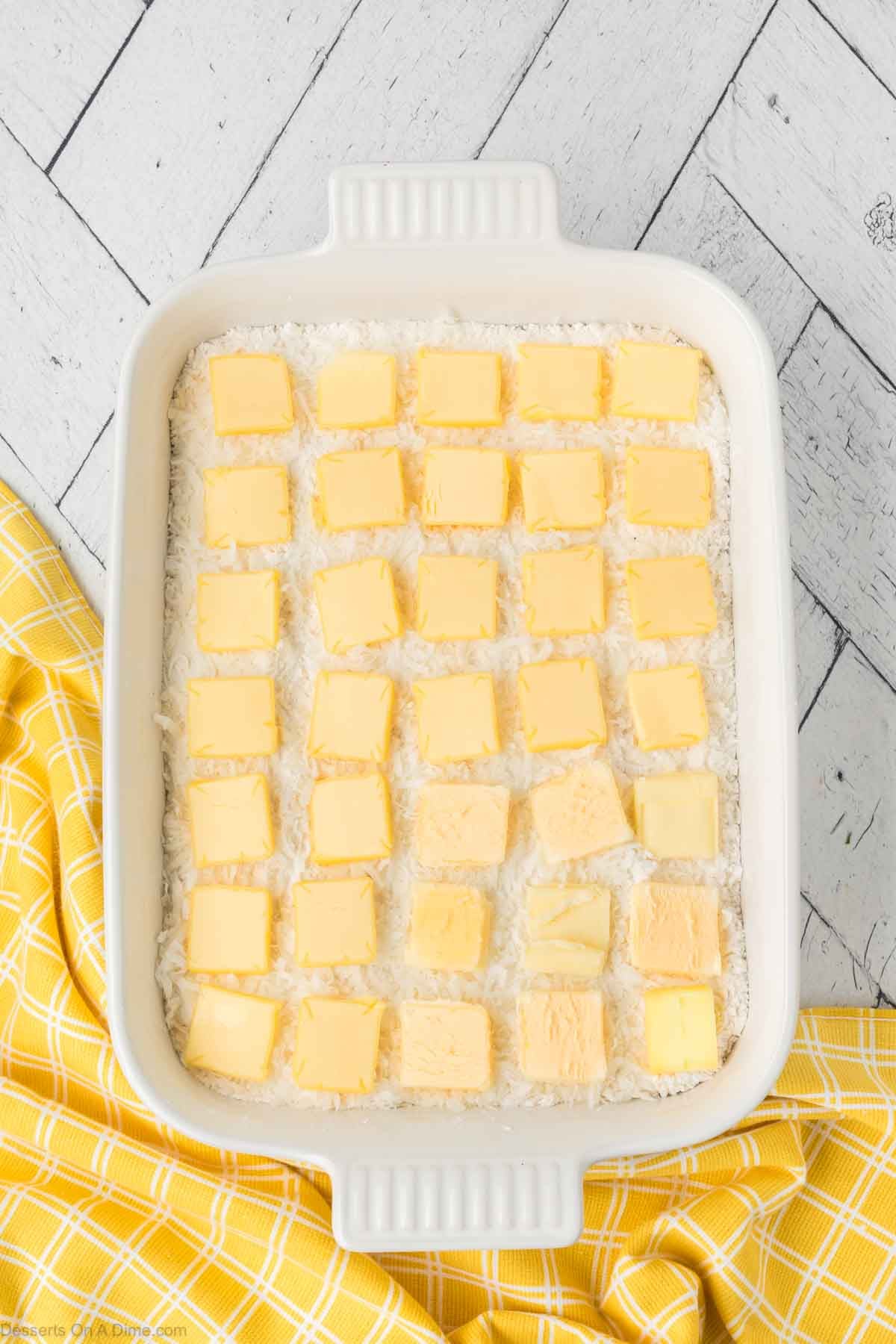 Sliced Butter on top of cake mix. 