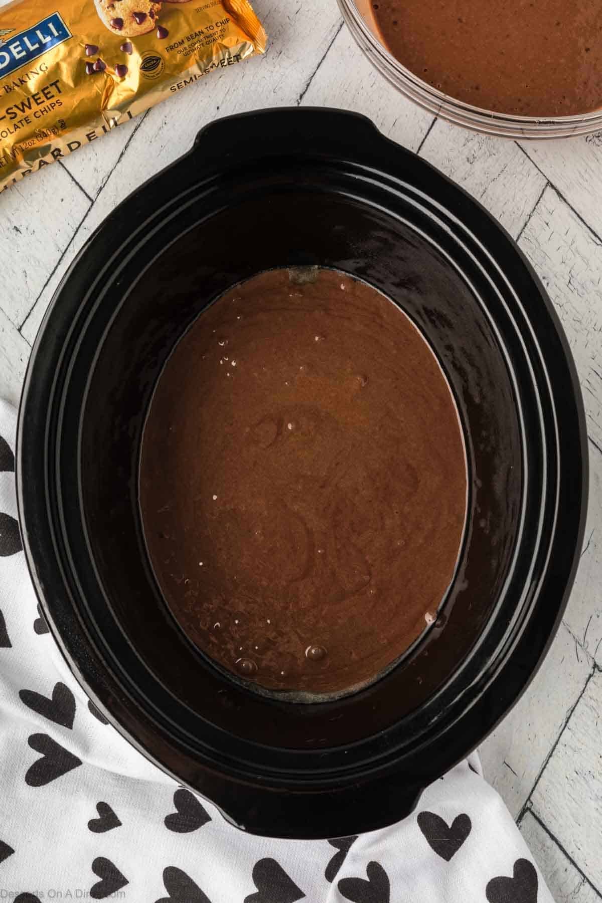 Batter combined and spread in crock pot. 