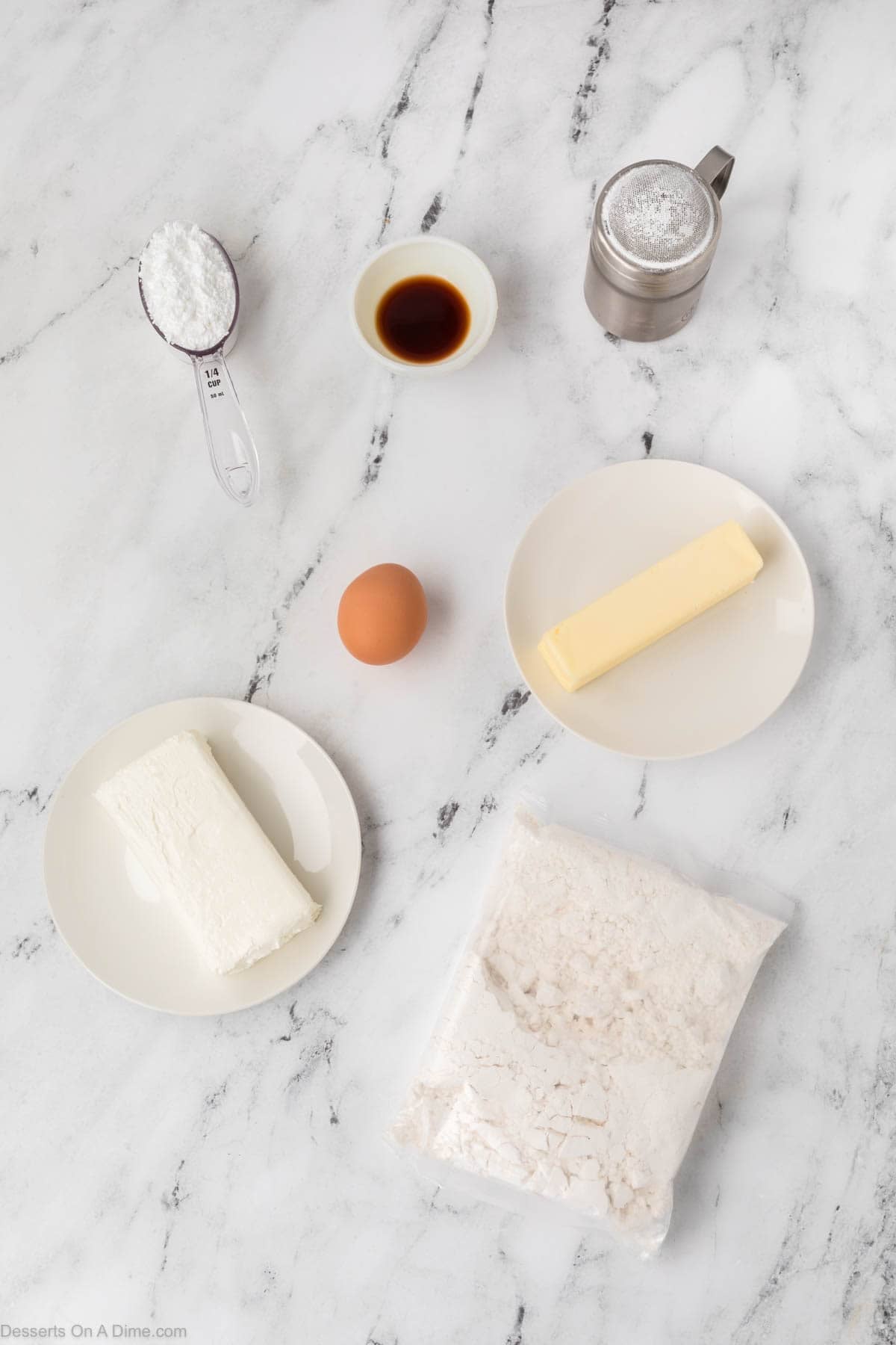 Ingredients for Ooey Gooey Cake Mix Cookies - cream cheese, butter, egg, vanilla, yellow cake mix, powdered sugar. 