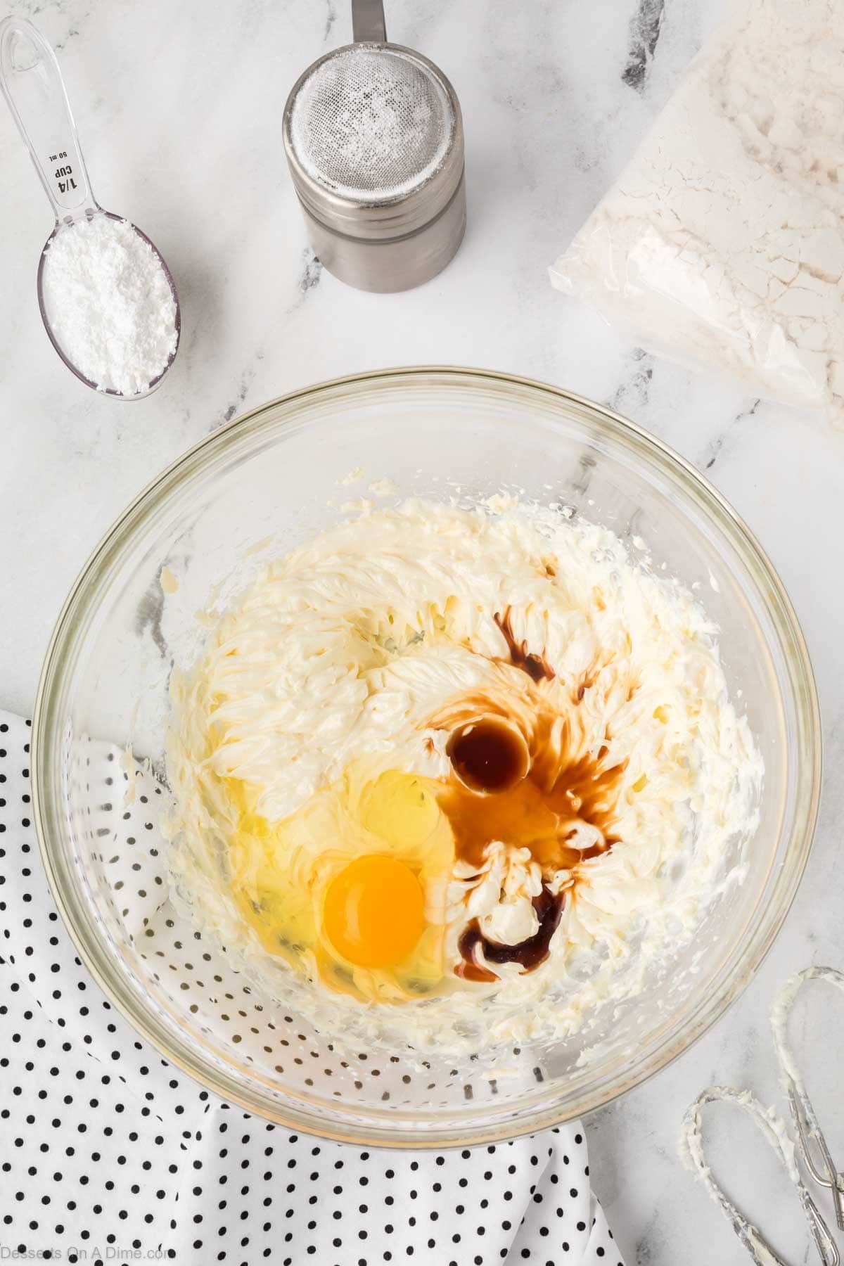 Eggs and vanilla mixed into cream cheese. 