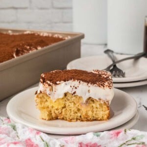 Slice of Tiramisu Poke Cake on a plate.