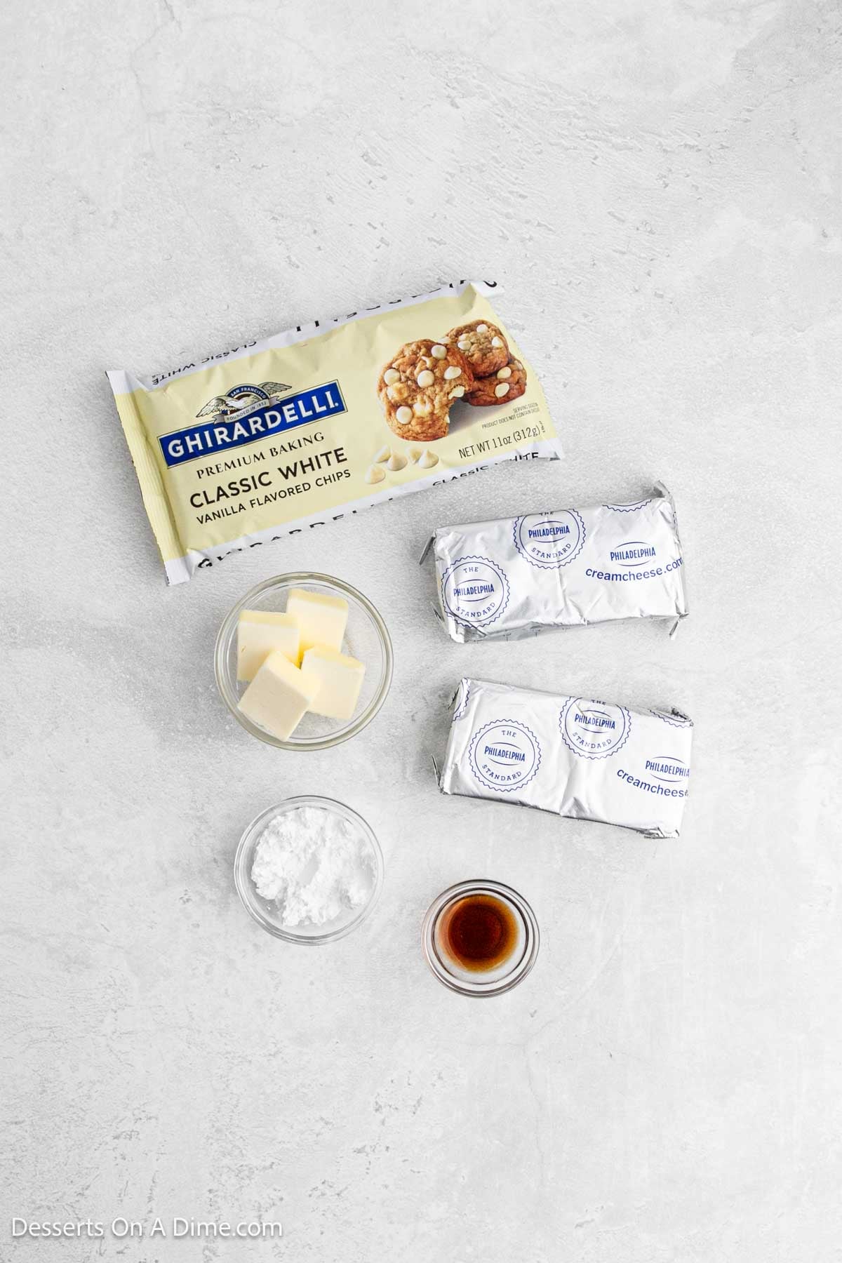 Ingredients for recipe: white chocolate, cream cheese, butter, powdered sugar and vanilla. 