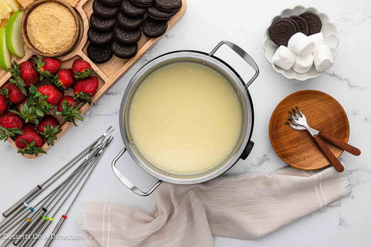Cheesecake Fondue surrounded by dippers. 